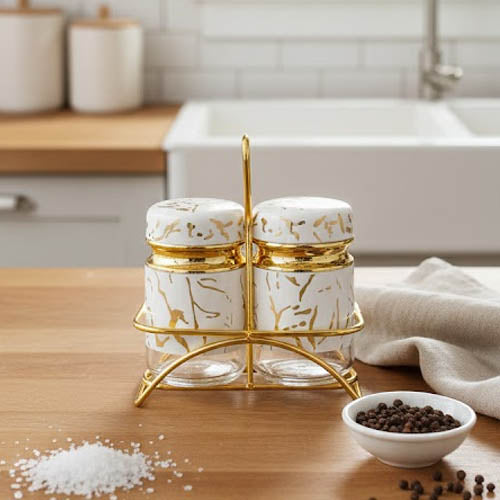 2-piece glass salt and pepper shaker set held in a gold-toned metal stand.