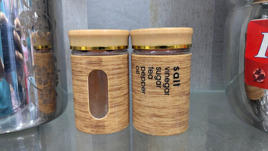 canister set features a bamboo-effect plastic coating and a gold lid. 2pcs set