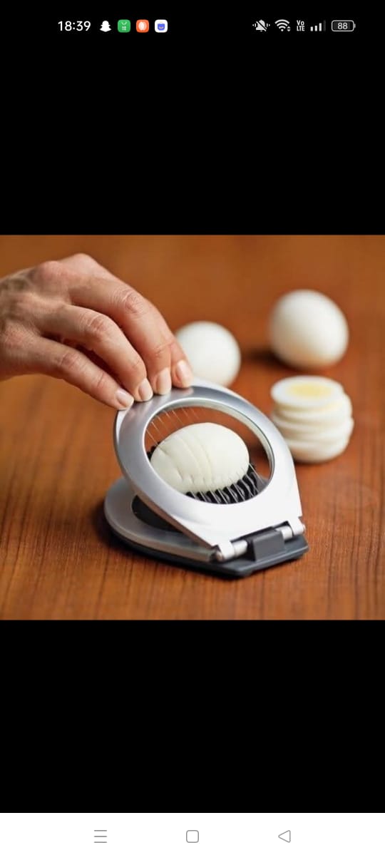 Stainless steel egg slicer.