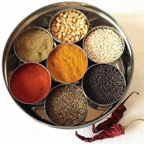 Round steel spice box with open lid showing spice bowls