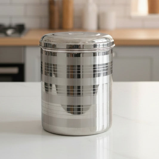 A set of stainless steel storage containers of varying sizes arranged together, commonly known as a 'dabba' or 'bartan'.