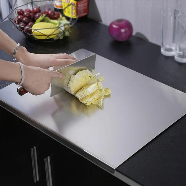Stainless steel cutting board with counter edge lip