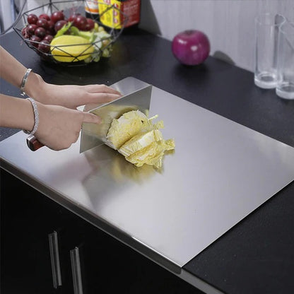 Stainless steel cutting board with counter edge lip