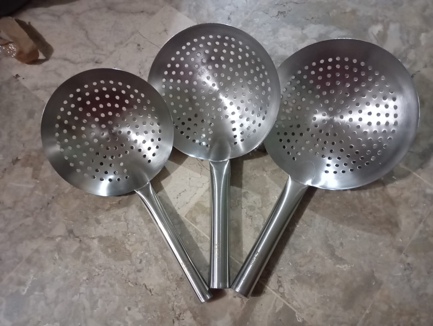 Stainless Steel skimmer strainers colander spoons, used for straining and frying various foods.