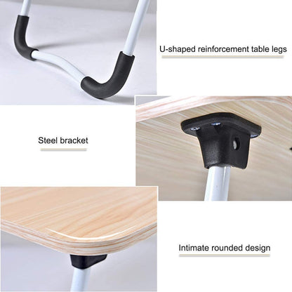This foldable laptop table features a smooth wooden top with a built-in cup holder and a slot for holding tablets or phones.